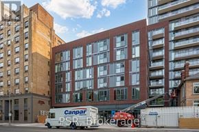 Toronto (Church-Yonge Corridor) house for rent - A Canpar PSR Brokerage truck is parked in front of a building.