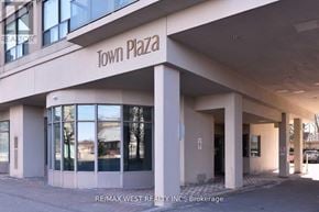 Toronto (Clanton Park) condo for rent - A building with the words "Town Plaza" on the front.