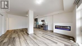 Toronto (Willowdale West) townhouse for rent - A spacious room with a fireplace and a television.