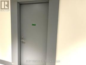 Toronto (Banbury-Don Mills) condo for rent - A door with a handle and a green sticker on it.