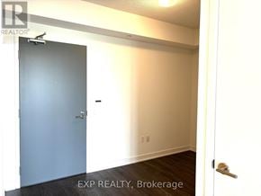 Toronto (Banbury-Don Mills) condo for rent - A room with a blue door and a white wall.