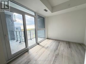 Toronto (Centennial Scarborough) condo for rent - A room with a view of a balcony through a glass door.