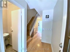 Toronto (Agincourt North) townhouse for rent - A hallway with a staircase leading to the second floor.