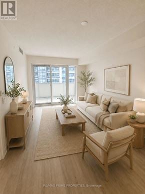 Pickering (Bay Ridges) condo for rent - A well-lit living room with a couch, chair, and coffee table.