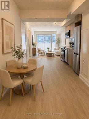 Pickering (Bay Ridges) condo for rent - A dining room with a table and chairs is shown in this image.