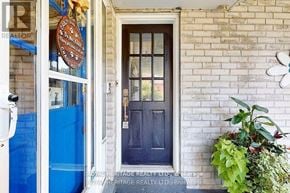 Toronto (Rouge) apartment for rent - A blue door with a sign above it that says "Royal Heritage Realty Brokerage".
