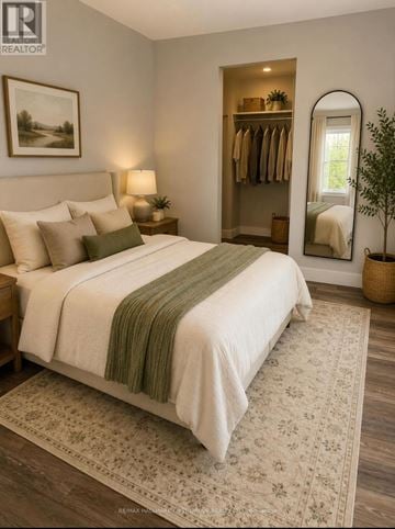 Oshawa (Lakeview) multi-family for rent - A bedroom with a large bed and a mirror on the wall.