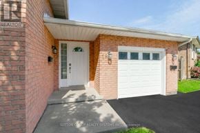 Cambridge apartment for rent - A house with a white garage door and a brick wall.