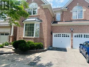 Milton (Co Coates) apartment for rent - A house with a white garage door and a blue car parked in front.