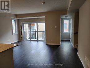 Cambridge townhouse for rent - A room with a brown floor and a glass door leading outside.