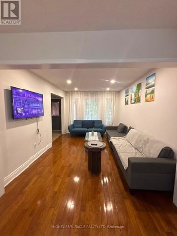 Brampton (Fletcher's West) apartment for rent - A living room with a television and a couch.