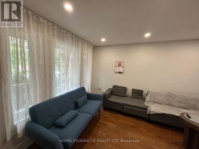 Brampton (Fletcher's West) apartment for rent - A living room with a blue couch and a grey couch.