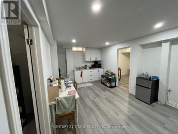 Whitby (Pringle Creek) apartment for rent - A kitchen with a dining table and chairs is shown in the image.