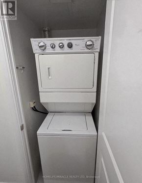 Mississauga (City Centre) condo for rent - A white washing machine and dryer in a small room.