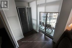 Toronto (Little Portugal) condo for rent - A room with a glass door leading to a balcony.