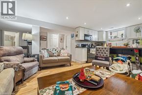 Hamilton apartment for rent - A living room with a grey couch and a wooden coffee table.