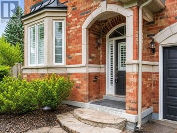 Oakville (Wm Westmount) apartment for rent - A red brick house with a black door and a small window.