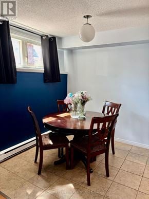 Russell condo for rent - A dining room with a table and chairs.