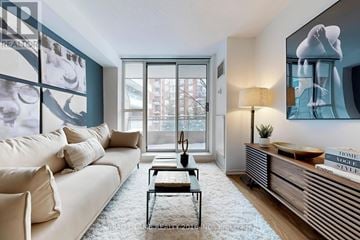 Toronto (Mount Pleasant West) condo for rent - A living room with a white couch and a coffee table.