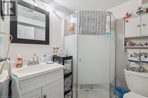 Hamilton (Huntington) apartment for rent - A bathroom with a white sink and a white toilet.