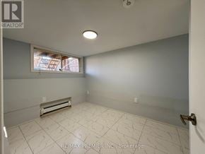 St. Catharines (Fairview) apartment for rent - A room with a window and a tiled floor.