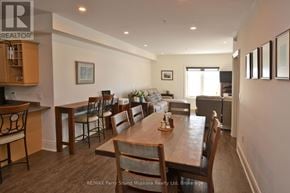 Parry Sound condo for rent - A dining room with a wooden table and chairs.