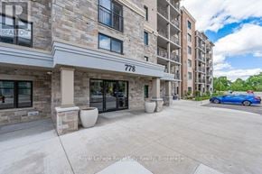 Waterloo condo for rent - A Royal LePage Royal City Realty office is located in a multi-story building with a blue car parked in front.