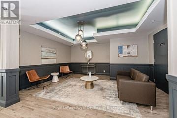 Waterloo condo for rent - A living room with a round table and chairs.