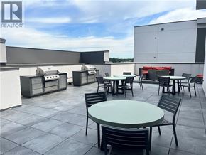 Waterdown condo for rent - A patio with a table and chairs is shown.