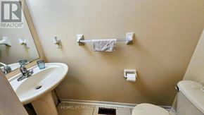 Brampton (Fletcher's Meadow) apartment for rent - A bathroom with a sink, toilet, and a towel rack.