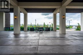 Grimsby (Grimsby Beach) condo for rent - A parking garage with a view of the ocean through the pillars.