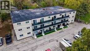 Cambridge apartment for rent - A building with a parking lot in front of it.