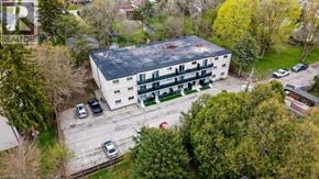 Cambridge apartment for rent - An aerial view of a building with a parking lot in front of it.