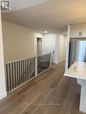 Wellington North (Mount Forest) townhouse for rent - A room with a white table and a white door.