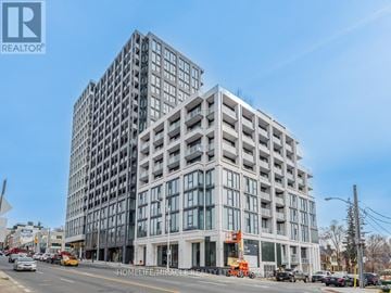 Toronto (Humewood-Cedarvale) condo for rent - A large, modern building with many windows is under construction.