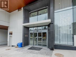 Toronto (Humewood-Cedarvale) condo for rent - The front of a building with a glass door and a sign that reads "SOSU".