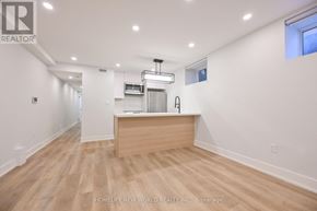 Toronto (Dufferin Grove) apartment for rent - A spacious room with a wooden counter and a window.