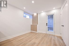Toronto (Dufferin Grove) apartment for rent - A room with a door leading outside and a window with blinds.