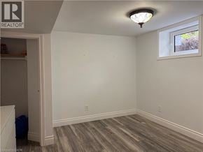 Ancaster apartment for rent - A room with a window and a wooden floor.