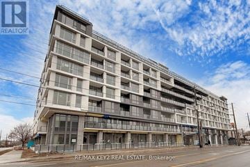 Toronto (Yorkdale-Glen Park) condo for rent - A large, multi-story building under construction with the RE/MAX Key2 Real Estate Brokerage logo on the top left.