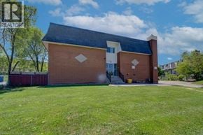 Cambridge apartment for rent - A brick building with a black roof and a white door.