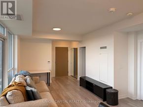 Toronto (Agincourt South-Malvern West) condo for rent - A living room with a couch and a bench.