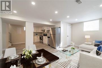 Hamilton (Westcliffe) apartment for rent - A modern kitchen with a dining table set for two.