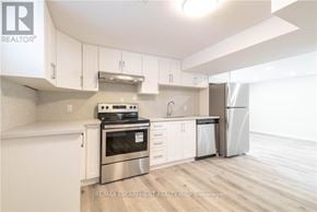 Hamilton (Westcliffe) apartment for rent - A modern kitchen with white cabinets and stainless steel appliances.