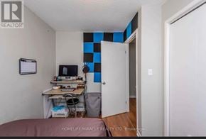 Thorold (Confederation Heights) apartment for rent - A room with a desk and a chair in it.
