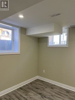 Pickering apartment for rent - A room with a window and a wall with a light switch.