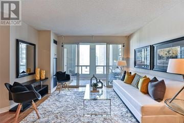Toronto (Bay Street Corridor) condo for rent - A living room with a white couch and a coffee table.