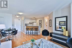 Toronto (Bay Street Corridor) condo for rent - A living room with a dining table and chairs.