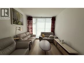Vancouver apartment for rent - A living room with a grey couch and a coffee table.