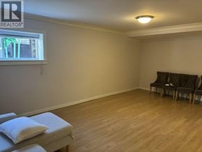 Burnaby apartment for rent - A room with a window, a bench, and a cushion on the floor.